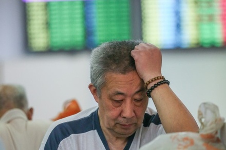 Центробанк Китая понизил курс юаня до минимума с лета 2011 года